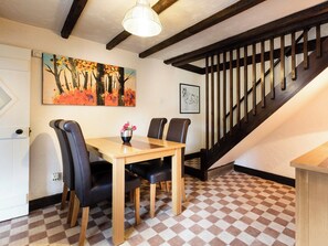 Lovely dining area and stairway to first floor | Pitts Cottage, Brancaster