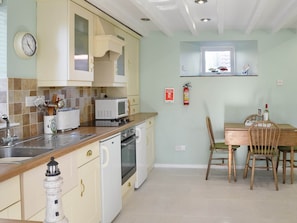 Well equipped kitchen/ dining area | Aidan Cottage, Craster, near Alnwick