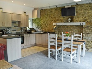 Stylishly furnished kitchen/dining area | Stable - Rosecraddoc Manor, Near Liskeard