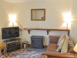 Welcoming living room with wood burner | Bodwi Isaf - Bodwi Farm Cottages, Near Abersoch