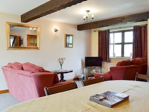 Convenient dining area within living and dining room | Big Barn - Hopgrove Farm Cottages, York