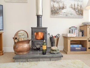 Warming wood burner in living room | Heather Croft - Hatton Cottages, Dunkeld, near Pitlochry