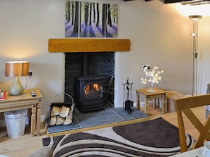 The living area has a feature fireplace | Capel Fawnog Bach - Capel Fawnog Mawr and Capel Fawnog Bach, Talsarnau near Harlech