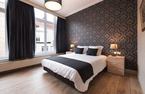 Rest easy in this cozy bedroom with a plush queen-size bed!