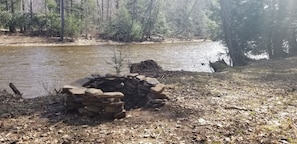 Enjoy a campfire along the riverbank.  A small amount of firewood is provided.
