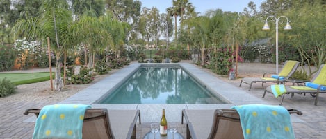 SCOTTSDALE SUNDOWN has a pool with comfy lounge chairs and and an amazing view of the Starfire Golf Course.