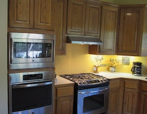 Gourmet Kitchen  Features  Gas Oven, Electric Oven and Microwave