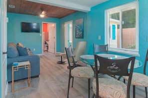 Living room with adjoining dining area.