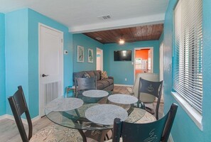 Living room with adjoining dining area.
