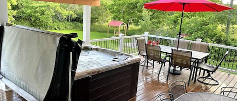Covered Deck with Hot tub and plenty of seating