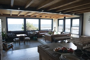 The open plan living space has wraparound views of the ocean