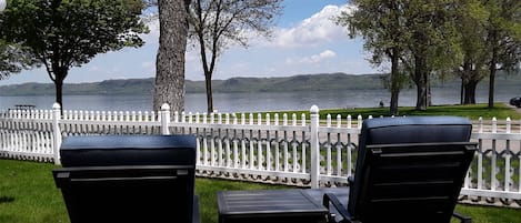 view of the lake from the chaise lounges