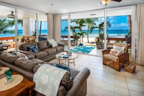 Step off the veranda and onto the sand.  Huge wrap around glass doors.  Ocean!!!