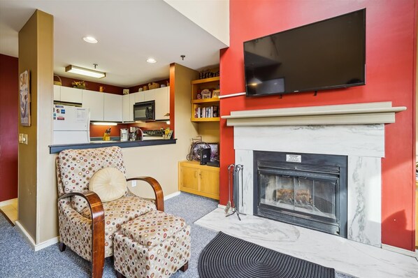After a long day on the slopes, sit near the fireplace and relax.