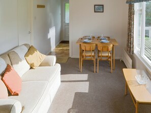 Light and airy living room with dining area | Silver Birches, Horning