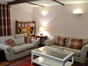 Cosy country living room with beamed ceiling and woodburner | Sycamore Cottage, Grassington