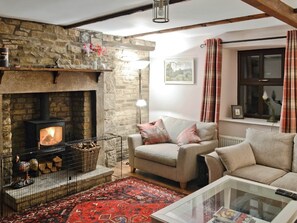 Cosy country living room with beamed ceiling and woodburner | Sycamore Cottage, Grassington