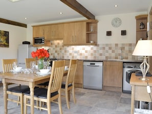 Well-equipped kitchen and dining area | The Cartshed - Thistle Hill Farm Cottages, Knaresborough