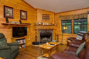 Living Room with Wood Fireplace and Pool Table