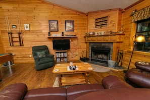 Living Room with Wood Fireplace and Pool Table