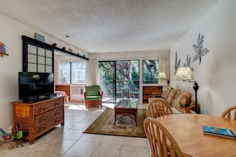 Tropical view condo just steps to white sand beach