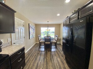 Breakfast nook, kitchen with pantry and Luxury Vinyl flooring