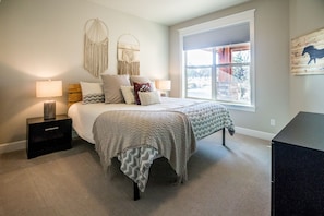 Main floor bedroom with a King bed and cable TV