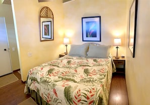 Queen size bed under open vaulted ceiling & fan for great ventilation