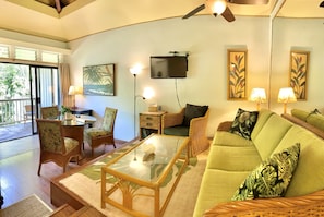 Tasteful tropical furnishings in a bright and efficient space with private lanai