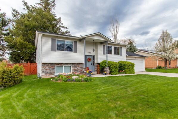 Summer scene. Bright, large, upper level with private entrance and secure garage