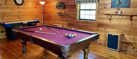 Game loft with regulation pool table and air hockey table