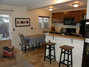 Kitchen has heated floor! Granite counters, new cabinetry, new appliances (range, micro, dishwasher), new sink....Heck, new everything! 