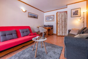 Lounge and dining area with sofa bed and sofa