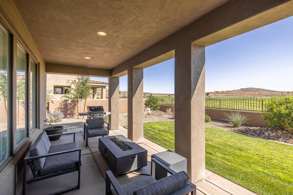 Back View - Enjoy the weather and watch the golfers from this beautiful back patio.