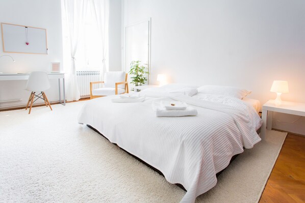 Large bedroom with king size bed (180x200) and pull out sofa and a crib