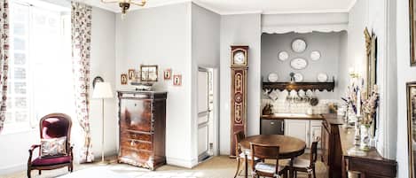 Handsome antique furnishings and modern conveniences like the kitchenette.