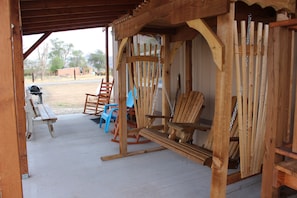 Porch is equipped with all the best. A swing, rocker and stocked grill.