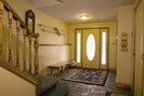 Spacious entrance with access to top floor and tandem garage