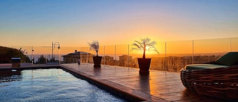 enjoy the sunset at the private pool