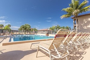Heated pool is just steps from the unit.