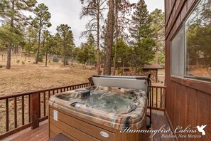 view of back deck, w/ hot tub