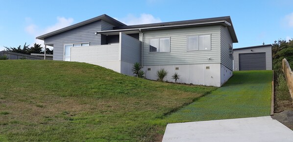 Front view with new driveway