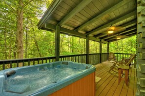 Hot tub privately located on the back deck