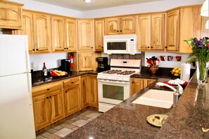 Fully equipped kitchen w/crockpot, griddle, pot/pans, plates, cups, wine glasses