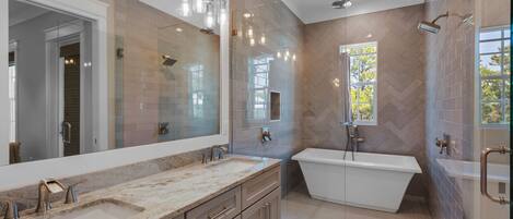 Large wet area includes a free standing tub and separate shower, natural light