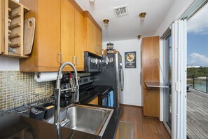 The second floor full kitchen is outfitted with premium appliances.