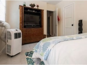 Bedroom with portable A/C. 