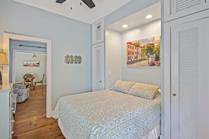 Master queen bedroom with private front entrance and TV