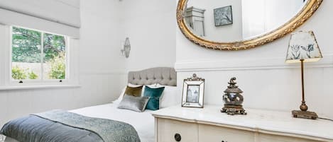 Queen master bedroom with French bed linen