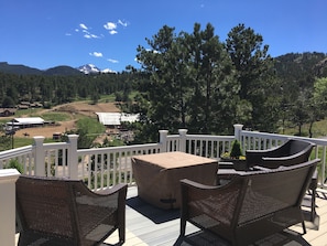 The deck in back of Elkhorn Cottage with a view of Longs Peak.